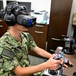 Sailor uses virtual reality headset and joystick