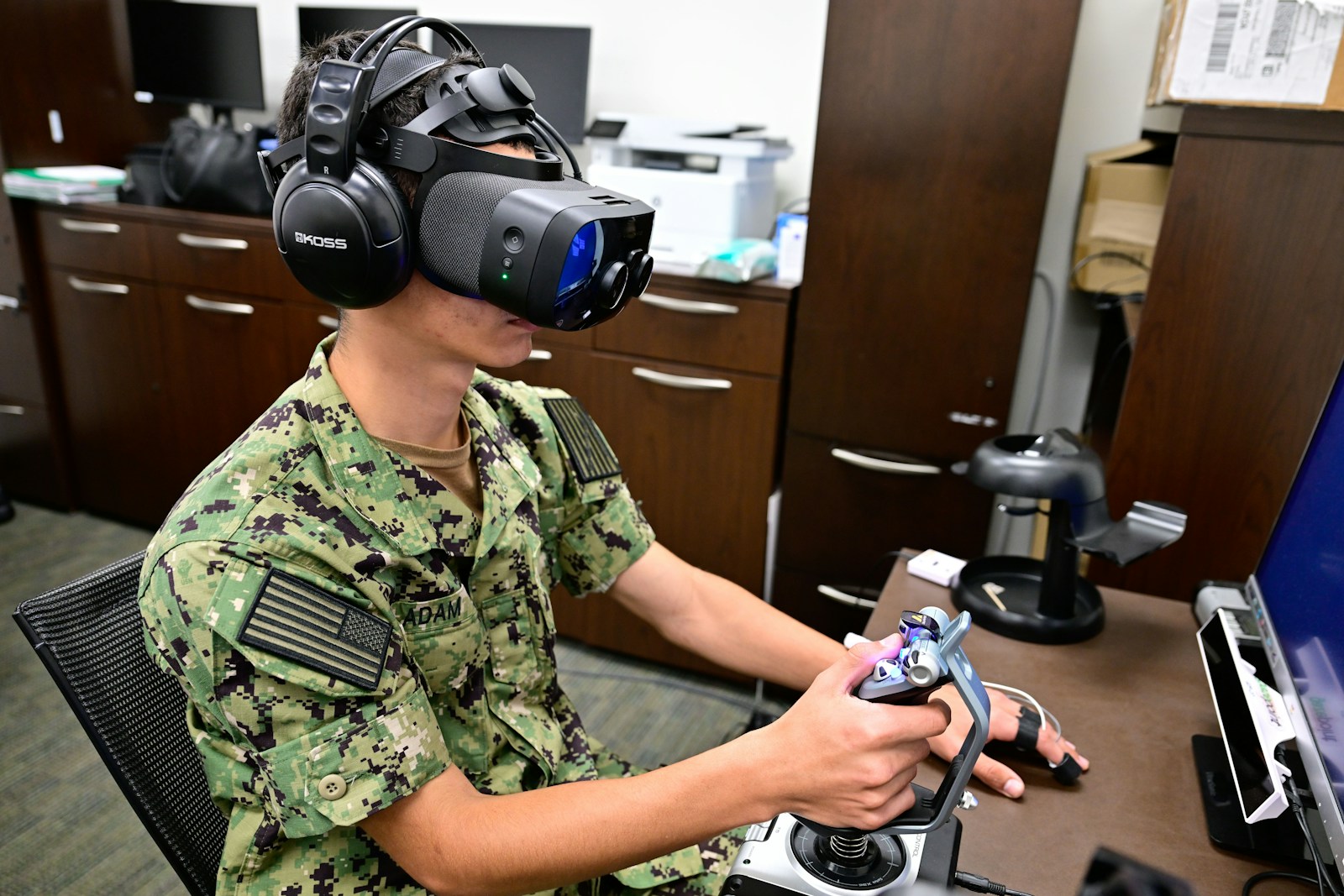 Sailor uses virtual reality headset and joystick