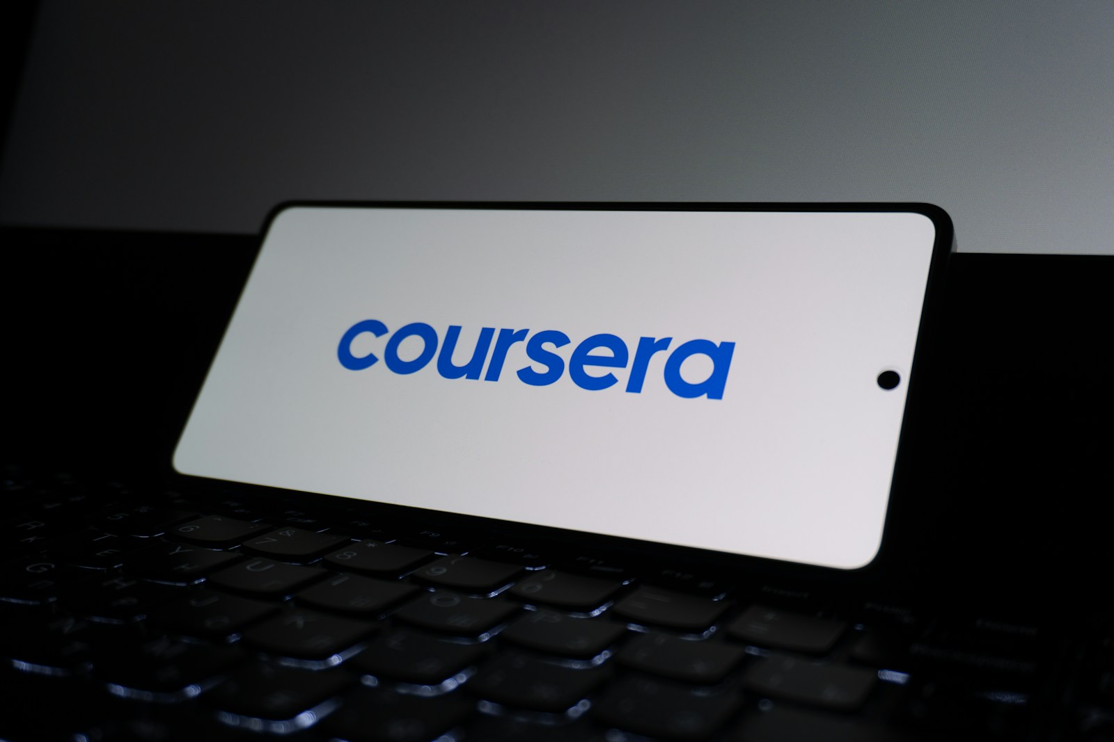 Coursera logo on a smartphone screen.